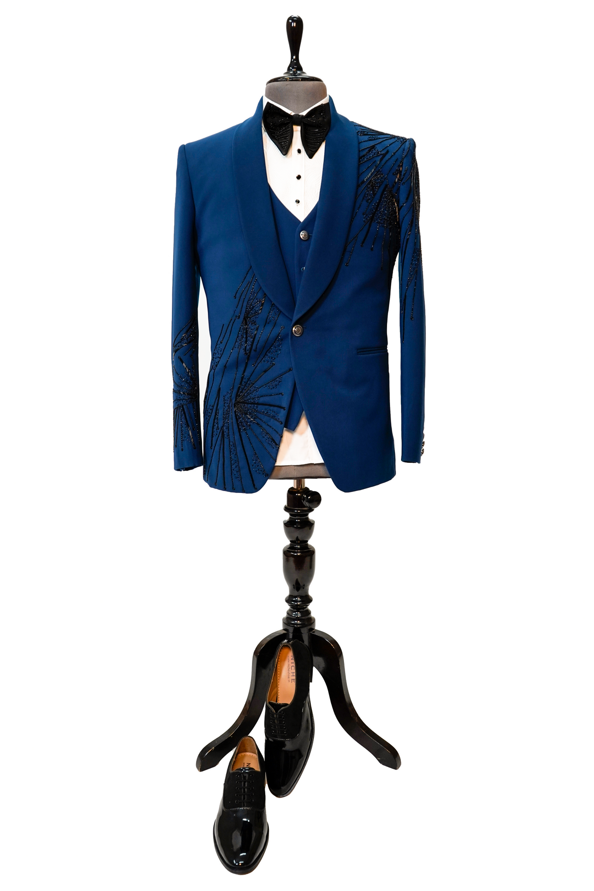 A teal blue 3-piece tuxedo with intricate curtdana embroidery displayed on a mannequin