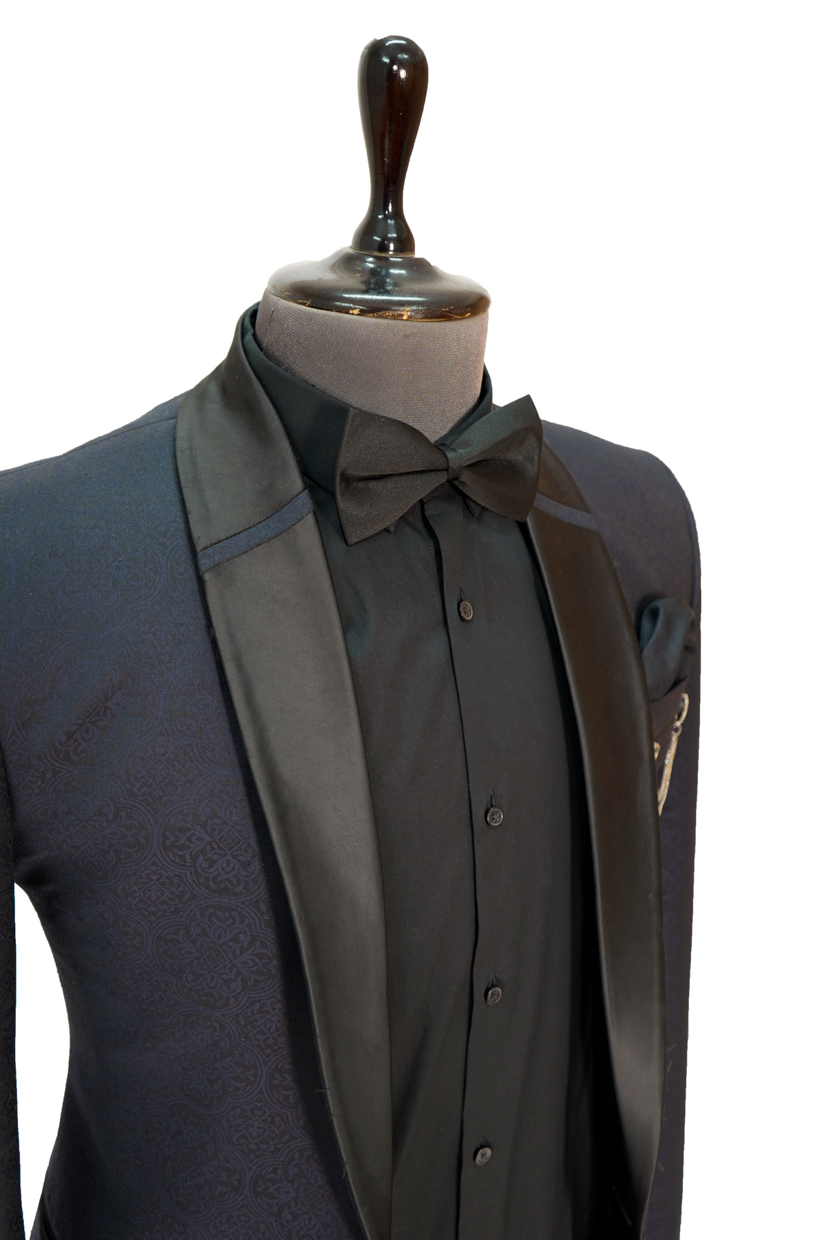 A midnight blue jacquard 2-piece tuxedo displayed on a mannequin, featuring a jacket with satin lapels and a shirt.