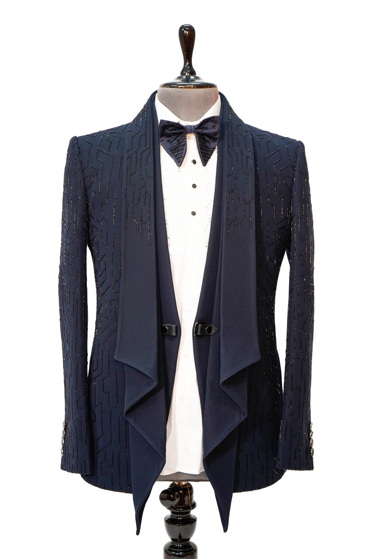 A Midnight Blue 5-Piece Designer Tuxedo displayed on a mannequin, consisting of a blue woolcrepe jacket, white vest, white shirt, blue bow tie, and blue trousers.