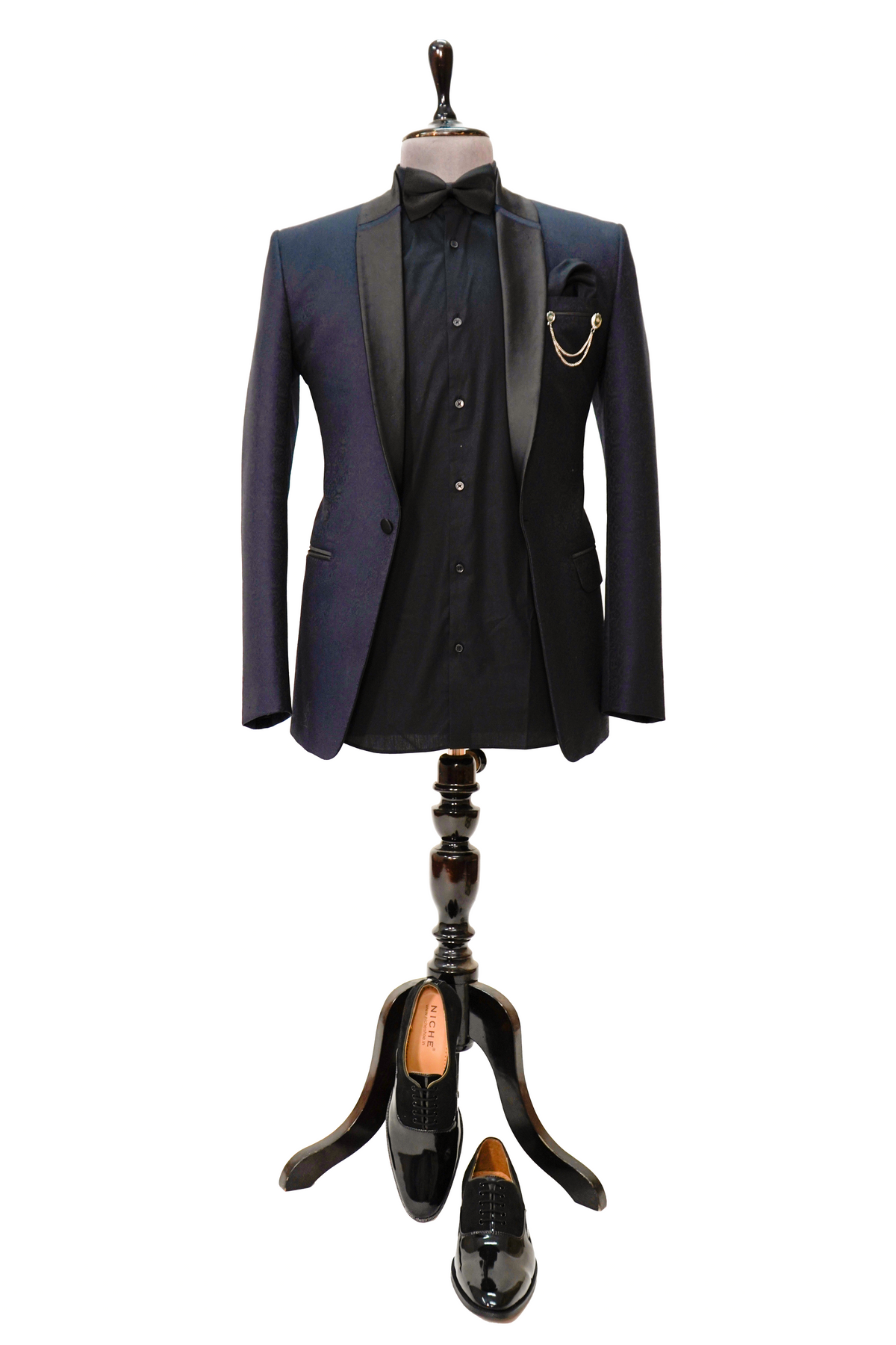 A midnight blue jacquard 2-piece tuxedo displayed on a mannequin, featuring a jacket with satin lapels and a shirt.