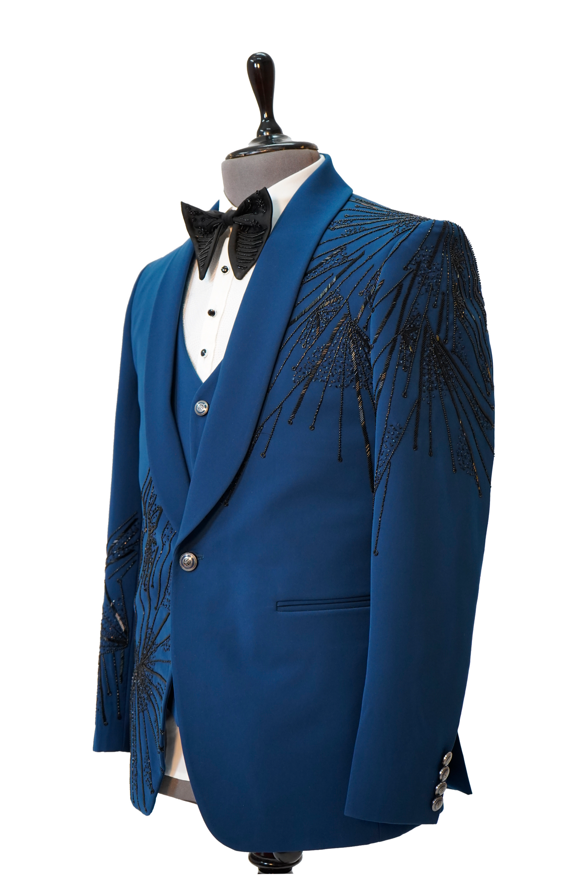 A teal blue 3-piece tuxedo with intricate curtdana embroidery displayed on a mannequin