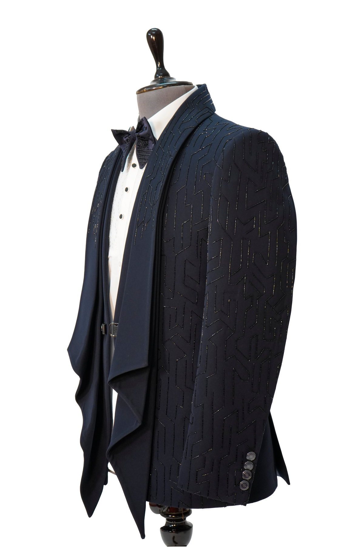 A Midnight Blue 5-Piece Designer Tuxedo displayed on a mannequin, consisting of a blue woolcrepe jacket, white vest, white shirt, blue bow tie, and blue trousers.