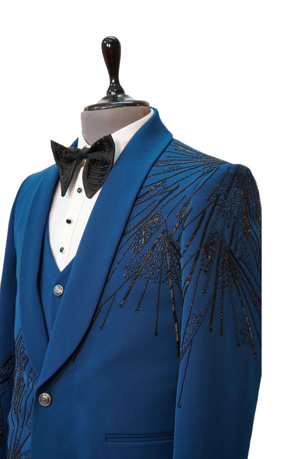 A teal blue 3-piece tuxedo with intricate curtdana embroidery displayed on a mannequin