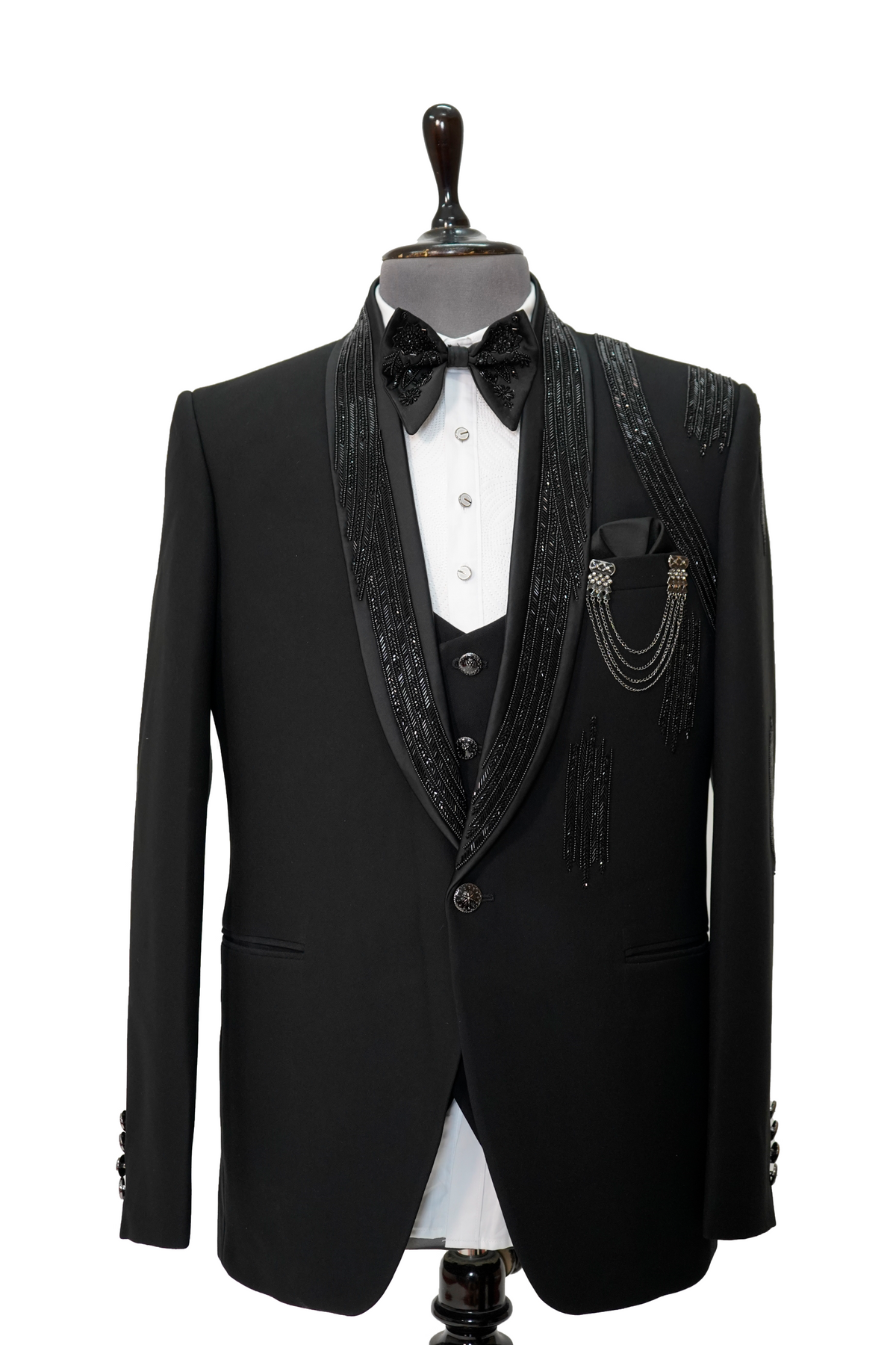 A Black Italian Woolcrepe 2-piece tuxedo with lapel and shoulder embroidery displayed on a mannequin.