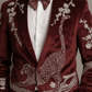Maroon velvet suit with intricate white embroidery on a neutral background