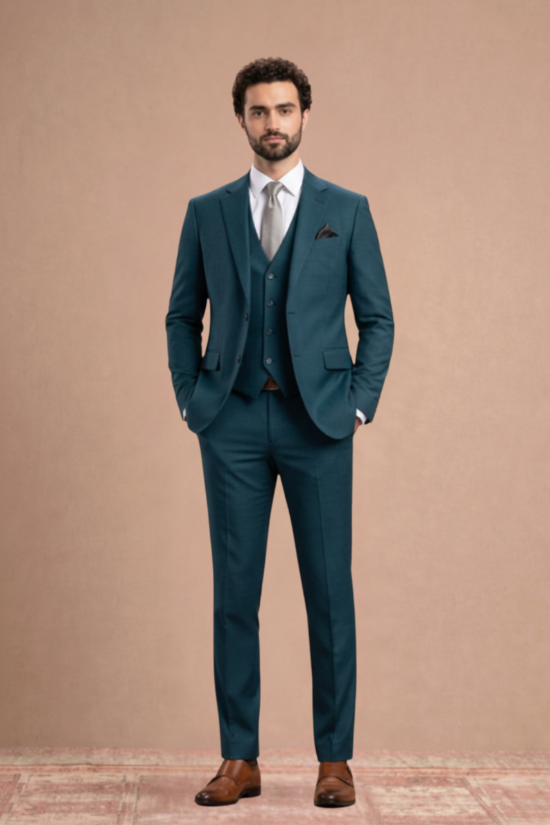Man wearing a teal suit with a white shirt and brown shoes on a beige background