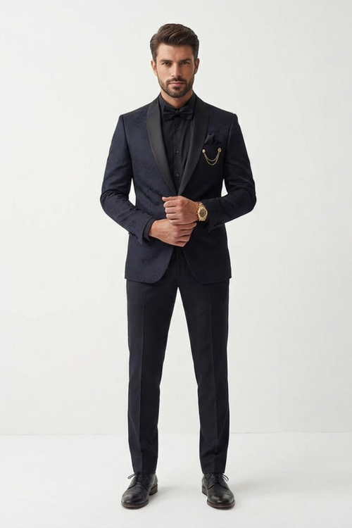 Man wearing a dark suit with a white shirt on a white background
