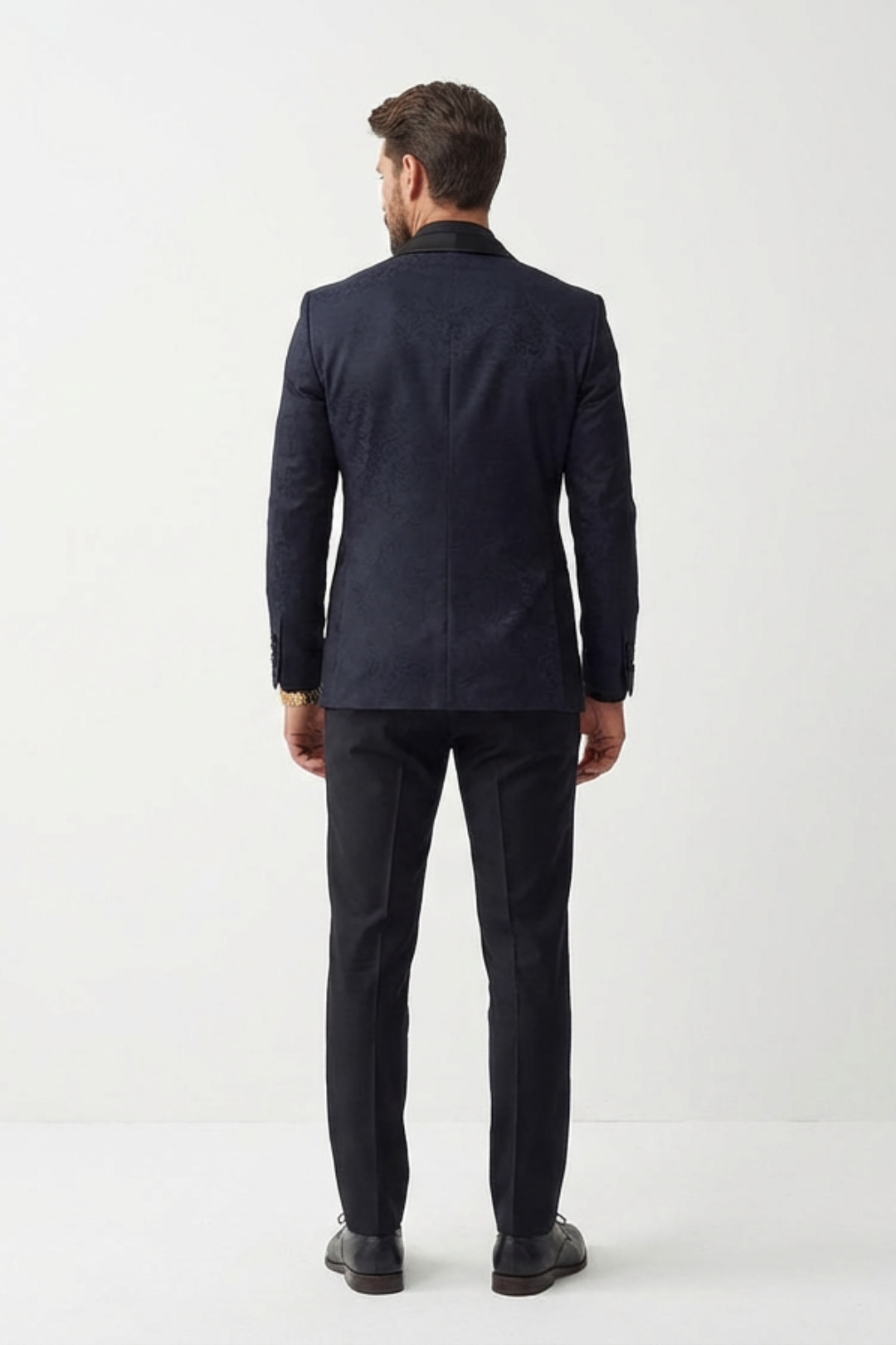 Man wearing a dark blue suit on a white background