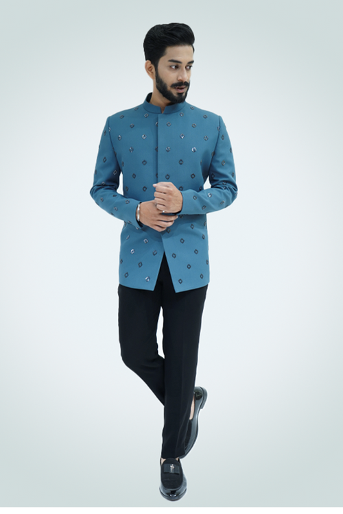 A man wearing an ash blue metallic cut dana embroidered jodhpuri with a collared neckline and button details.