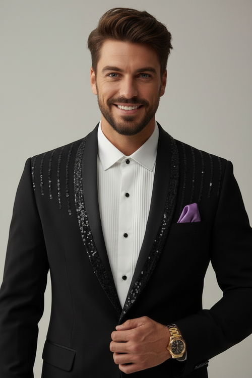 Man wearing a black tuxedo with a white shirt and purple pocket square against a gray background