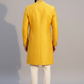 Man wearing a yellow traditional outfit against a gray background