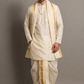 Man wearing a traditional white kurta with gold accents against a gray background
