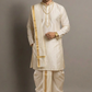 Man wearing a traditional white kurta with gold accents against a gray background