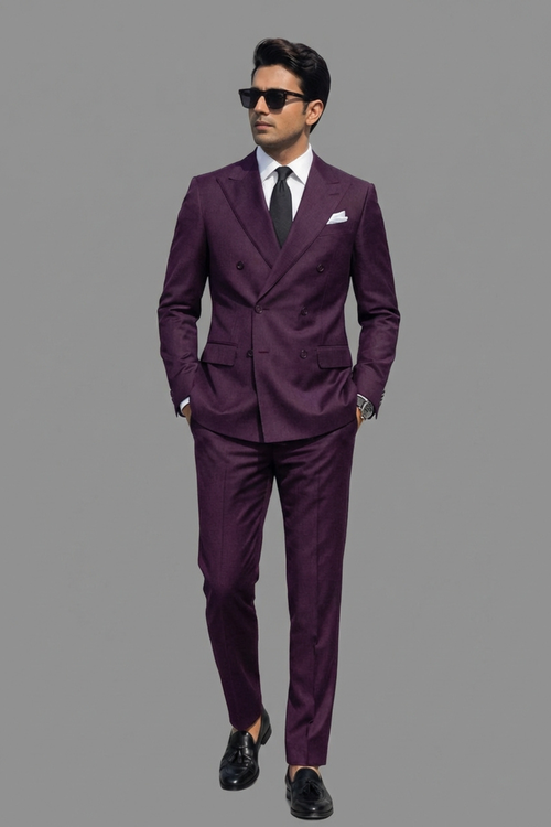 Man wearing a purple suit with sunglasses on a gray background