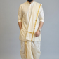 Man wearing a traditional cream kurta with a white dhoti and gold border against a gray background