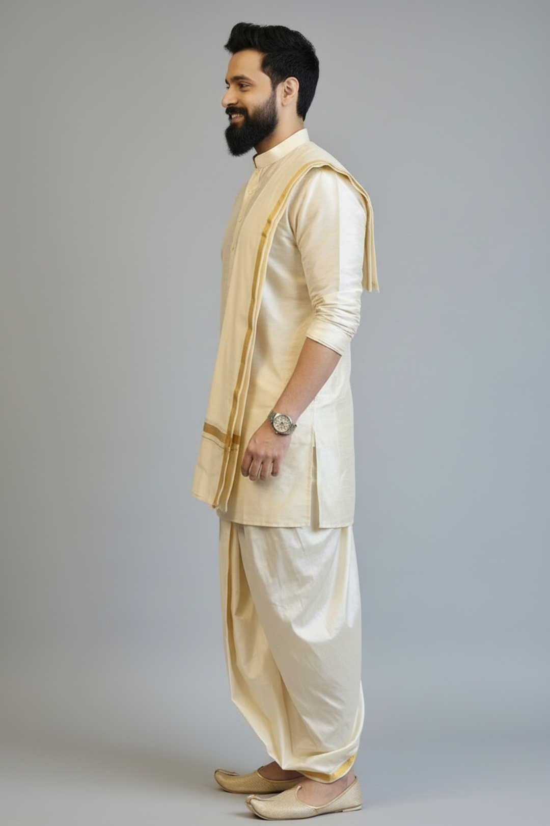 Man wearing a traditional cream kurta with a white dhoti on a gray background