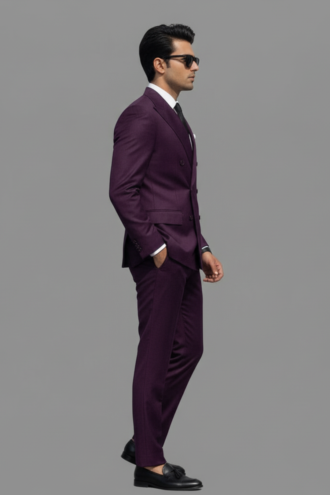Man wearing a purple suit on a gray background