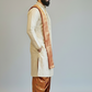Man wearing a traditional beige and brown kurta with a plain background