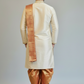 Man wearing a traditional kurta with a plain background