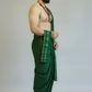 Man wearing a green dhoti with a white background