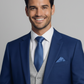 Man wearing a blue suit with a gray vest and white shirt on a gray background