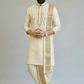Man wearing a traditional cream kurta with a white background