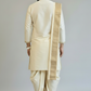 Man wearing a traditional cream kurta with a white background