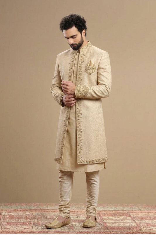 Man wearing a beige embroidered sherwani on a beige background