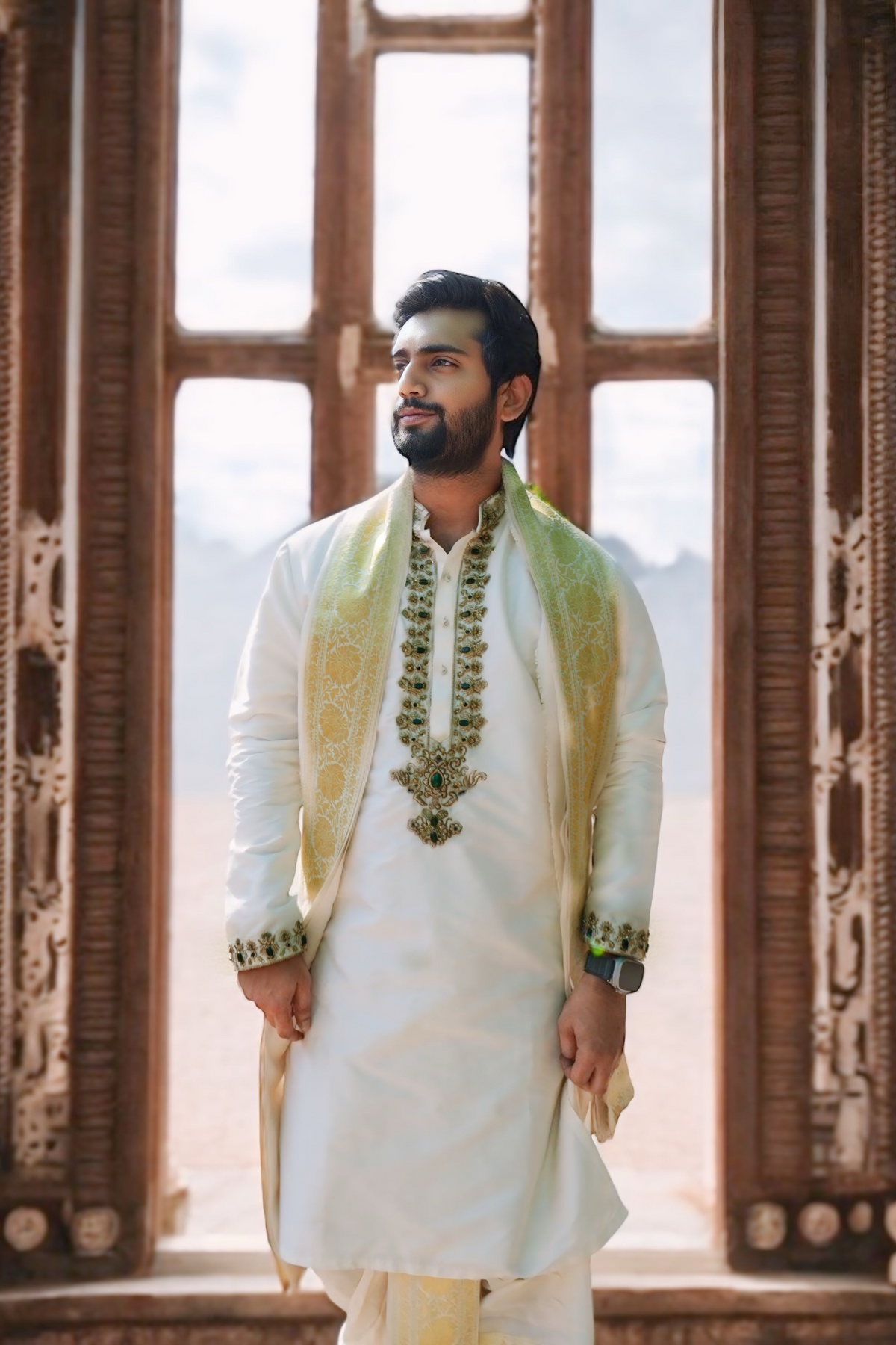 Off-white pattu pancha set with emerald detailed zardosi work