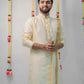 Off-white semi pattu pancha set with zari work on collar and cuffs