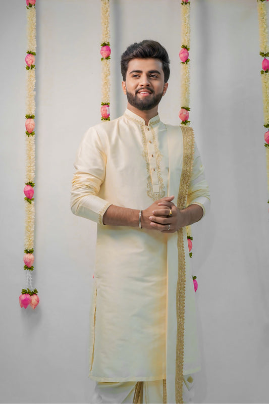 Off-white semi pattu pancha set with zari work on collar and cuffs