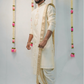 Off-white semi pattu pancha set with zari work on collar and cuffs