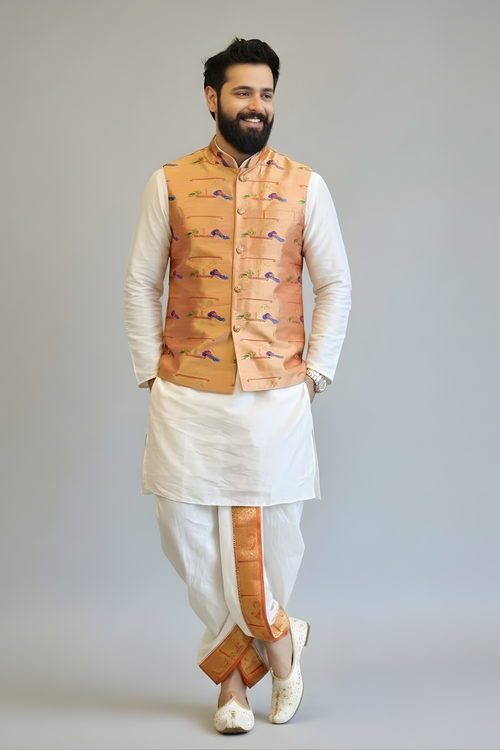 Man wearing a traditional outfit with a vest on a plain background
